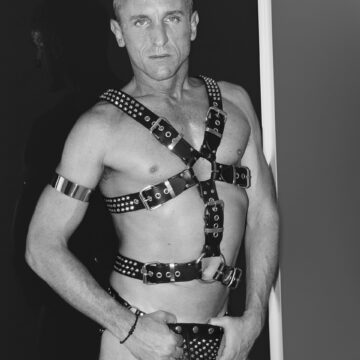 Man wearing Lucrezia & De Sade leather full body bondage harness with spikes.